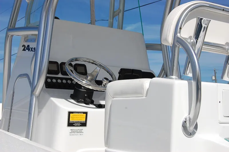 Slide: The Image of 2025 Cape Horn 27 XS boat console with steering wheel and controls. - 5