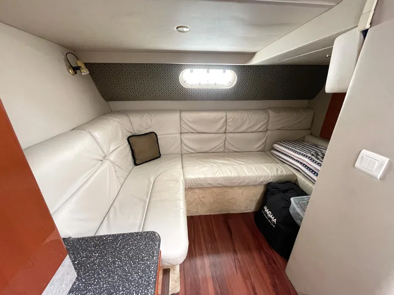 Slide: The Image of Interior of 2004 Formula 37 PC yacht with white leather seating and wood flooring. - 10