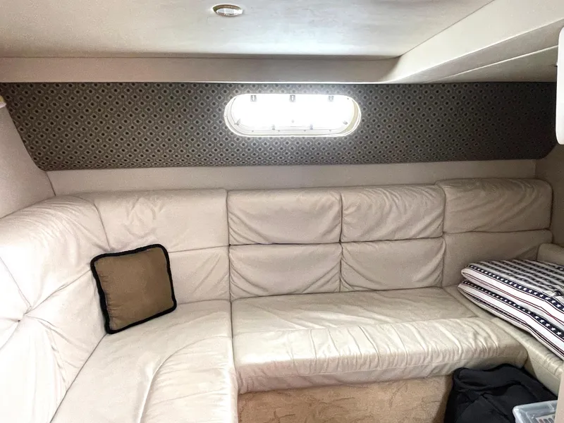 Slide: The Image of 2004 Formula 37 PC cabin interior with white leather seating and window. - 11