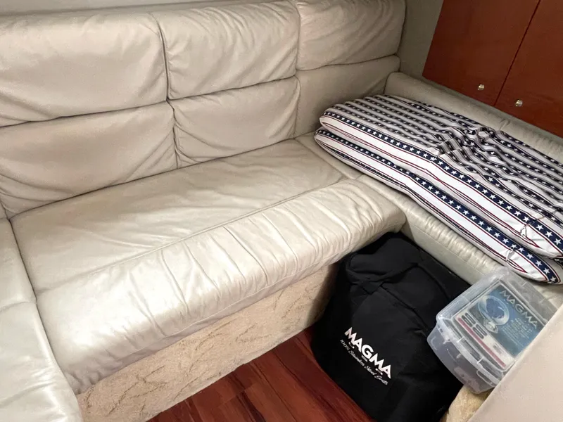 Slide: The Image of 2004 Formula 37 PC interior with leather seating, cushion, and storage items. - 12