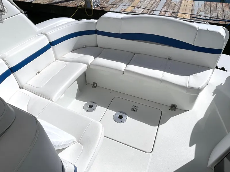 Slide: The Image of 2004 Formula 37 PC boat interior with white and blue seating. - 2