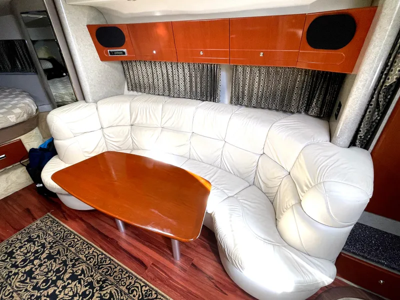 Slide: The Image of Luxurious interior of 2004 Formula 37 PC yacht with white leather seating and wooden table. - 6