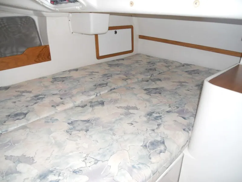 Slide: The Image of Interior of a 1999 Catalina 320 with bed and storage. - 12