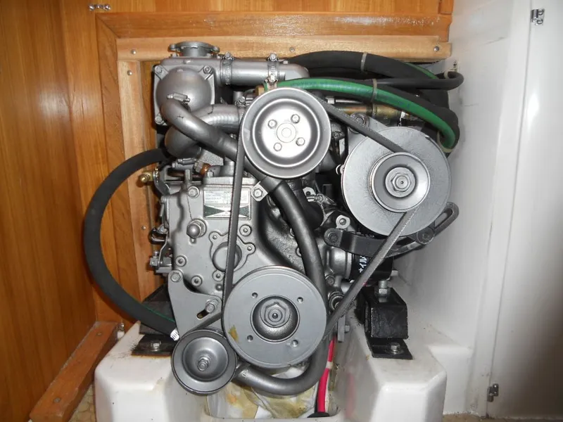 Slide: The Image of 1999 Catalina 320 engine with belts and hoses. - 16