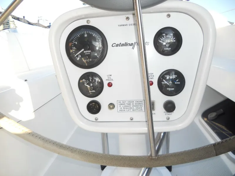 Slide: The Image of 1999 Catalina 320 yacht control panel with gauges. - 20