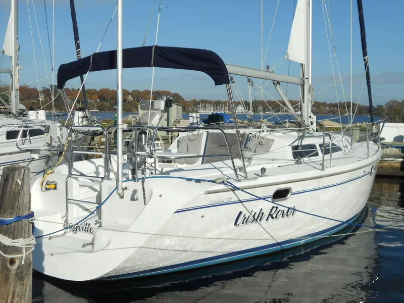 Slide: The Image of 1999 Catalina 320 sailboat docked in marina. - 24