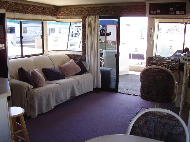 Slide: The Image of Interior of 1998 Jamestowner Widebody Multi Owner Houseboat with sofa and helm station. - 4