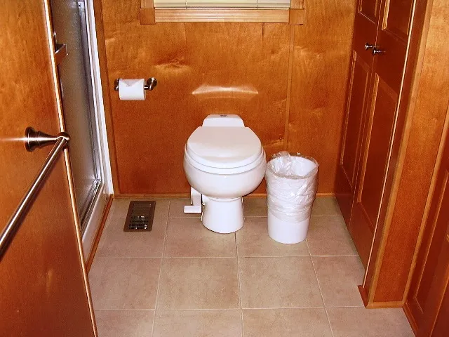Slide: The Image of Bathroom interior of 2005 Starlite Multi Owner Houseboat with wooden walls and tiled floor. - 9