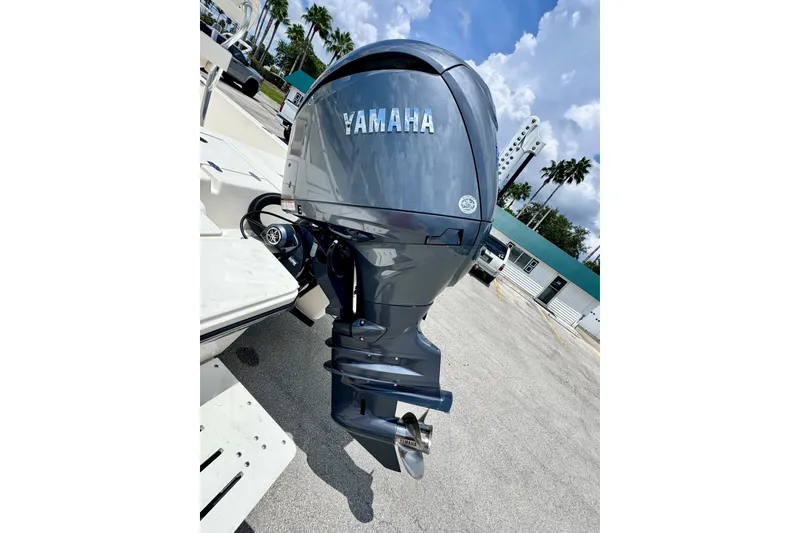 Slide: The Image of Yamaha outboard motor on 2012 Pathfinder 2200 TRS boat, parked outdoors. - 17