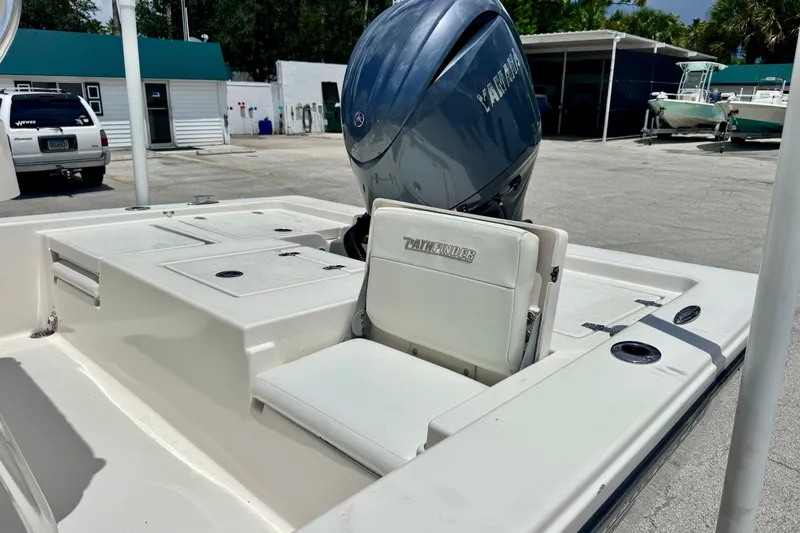 Slide: The Image of 2012 Pathfinder 2200 TRS boat with Yamaha outboard motor in a marina setting. - 16