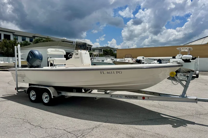 Slide: The Image of 2012 Pathfinder 2200 TRS boat on trailer under cloudy sky. - 10