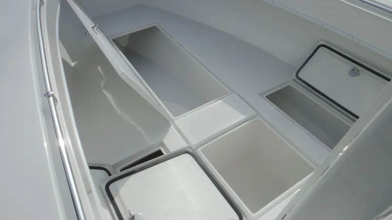 Slide: The Image of 2024 Contender 28T boat storage compartments. - 12