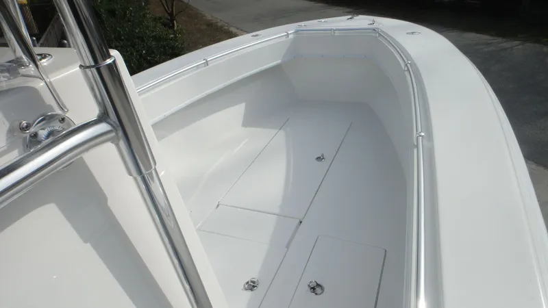 Slide: The Image of 2024 Contender 28T boat deck with storage compartments. - 14