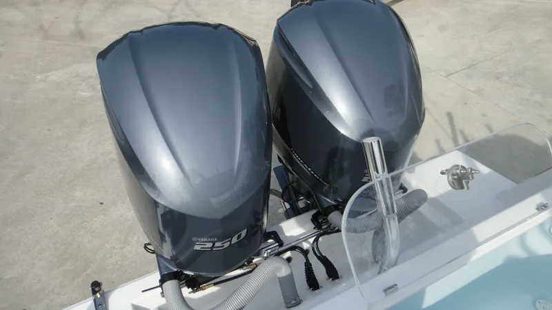 Slide: The Image of Twin outboard engines on a 2024 Contender 28T boat. - 20