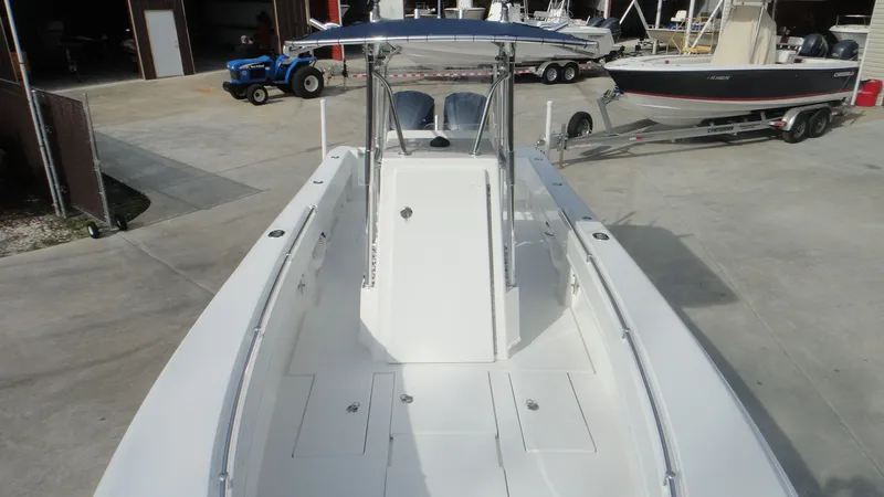 Slide: The Image of 2024 Contender 28T center console boat, docked in a marina. - 21