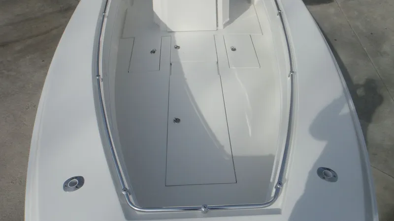 Slide: The Image of 2024 Contender 28T boat deck with storage compartments. - 22