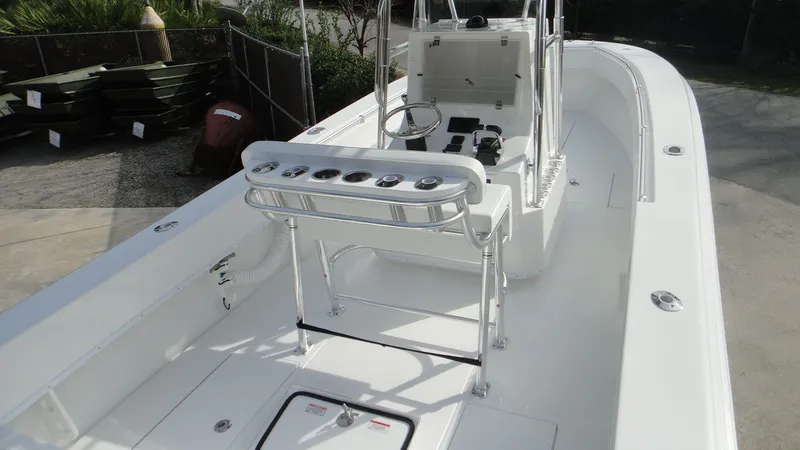 Slide: The Image of 2024 Contender 28T center console fishing boat with rod holders and spacious deck. - 23