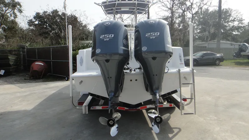 Slide: The Image of 2024 Contender 28T boat with twin 250 HP engines, rear view. - 24