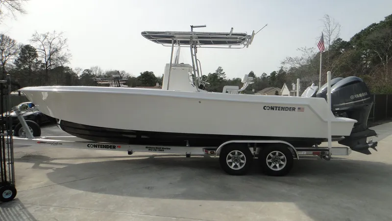 Slide: The Image of 2024 Contender 28T boat on trailer with dual Yamaha engines. - 4