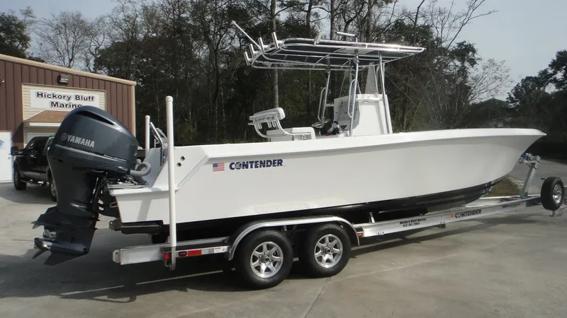 Slide: The Image of 2024 Contender 28T boat on trailer with Yamaha outboard motor. - 8