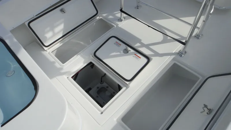 Slide: The Image of 2024 Contender 28T boat storage compartments and hatches. - 9