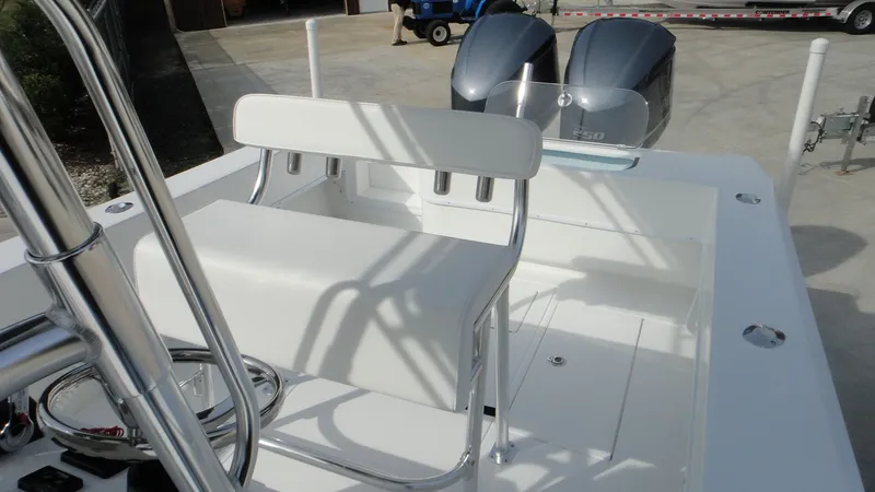 Slide: The Image of 2024 Contender 28T boat with dual outboard engines and white seating. - 16