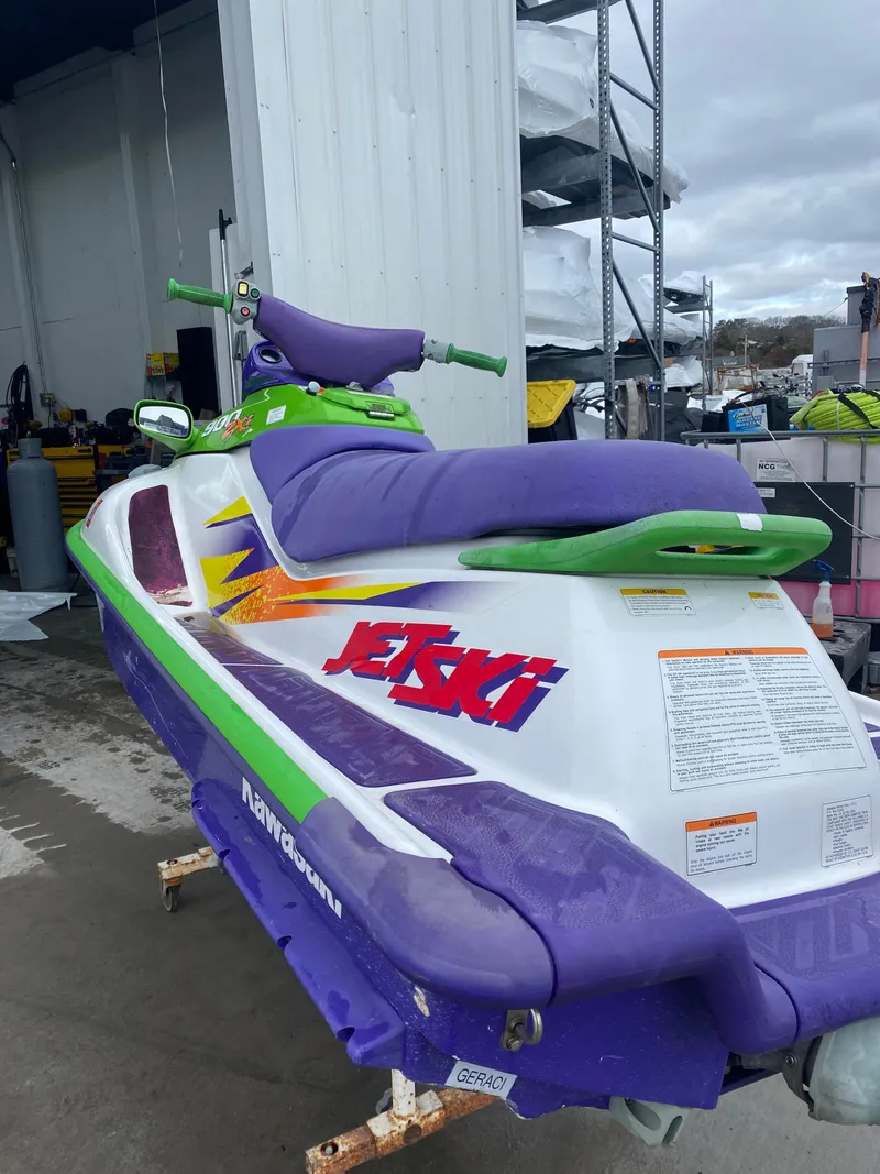 Slide: The Image of 1996 Kawasaki ZXI 900 Jet Ski with vibrant purple and green accents. - 5