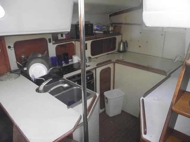 Slide: The Image of 1984 Irwin Center Cockpit yacht kitchen with sink and stove. - 19