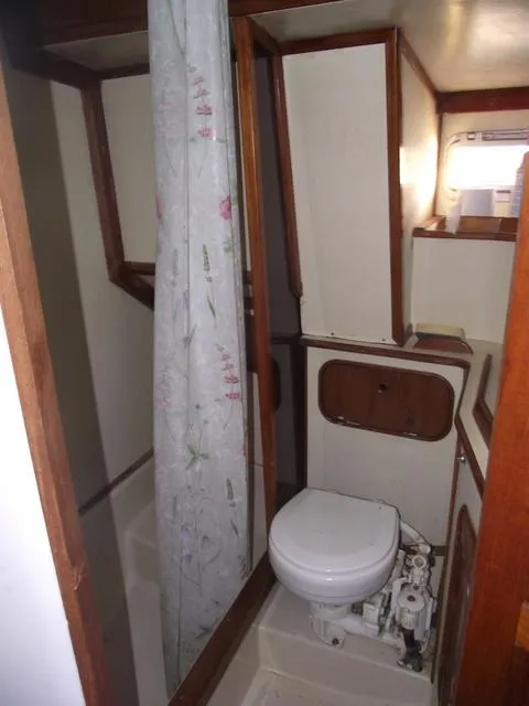 Slide: The Image of Interior of a 1984 Irwin Center Cockpit yacht with toilet and shower. - 27