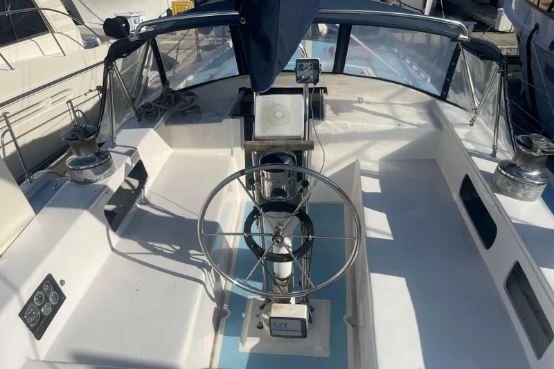 Slide: The Image of 1984 Irwin Center Cockpit sailboat with steering wheel and navigation equipment. - 38