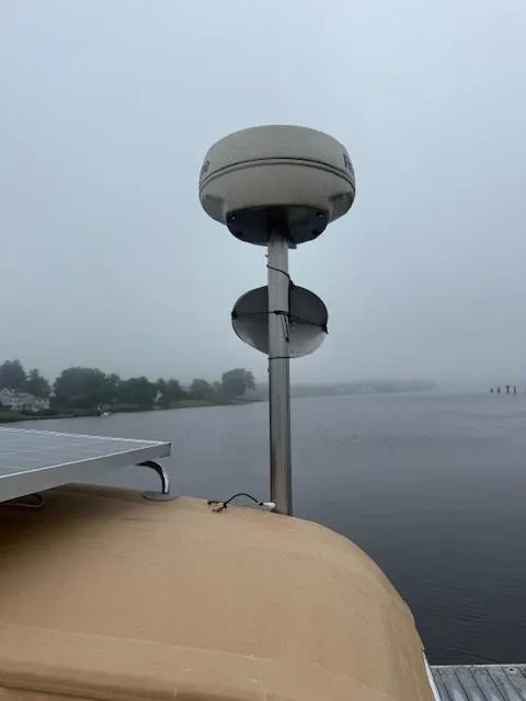 Slide: The Image of Radar equipment on a 2003 Wauquiez Centurion 45s yacht, docked on a foggy day. - 16