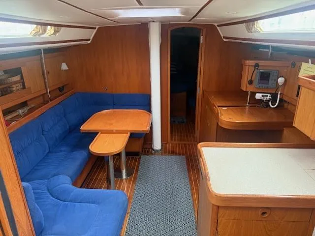 Slide: The Image of Interior of 2003 Wauquiez Centurion 45s sailboat with blue seating and wooden finishes. - 23