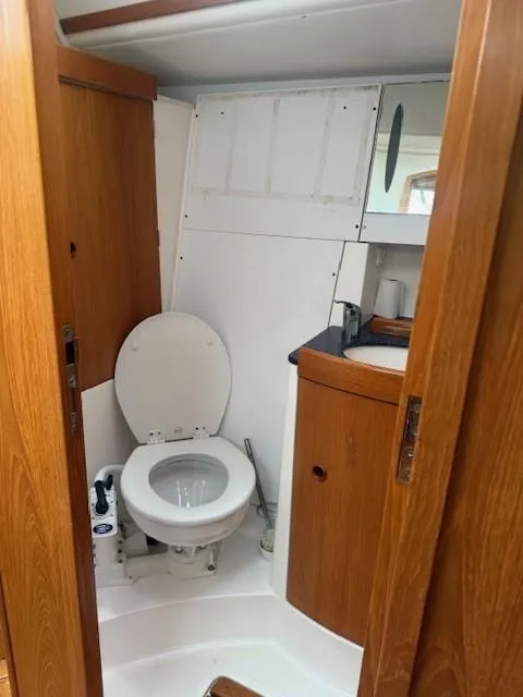 Slide: The Image of Bathroom interior of 2003 Wauquiez Centurion 45s yacht with wooden cabinetry. - 24