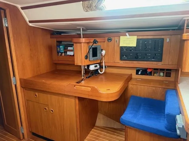 Slide: The Image of Interior of 2003 Wauquiez Centurion 45s yacht with navigation station and blue seat. - 29