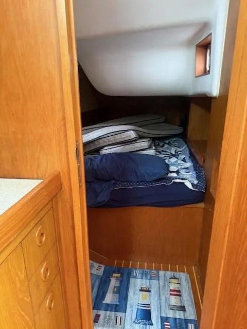 Slide: The Image of Cozy cabin interior of 2003 Wauquiez Centurion 45s sailboat with wooden finish and bedding. - 40
