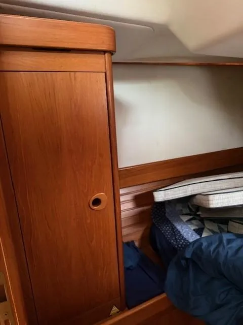 Slide: The Image of Interior cabin of 2003 Wauquiez Centurion 45s with wooden cabinetry and bedding. - 41