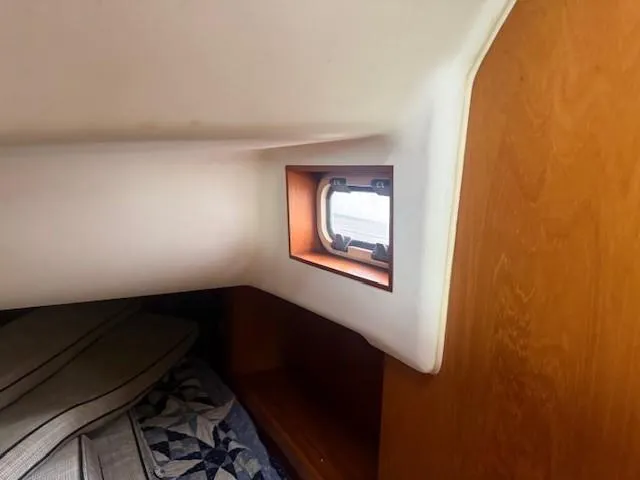 Slide: The Image of Interior cabin of 2003 Wauquiez Centurion 45s sailboat with window and bedding. - 47