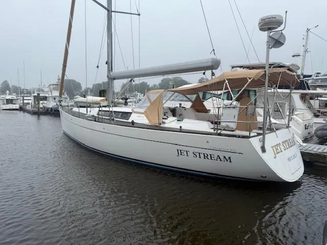 Slide: The Image of 2003 Wauquiez Centurion 45s sailboat docked in a marina, named "Jet Stream". - 5