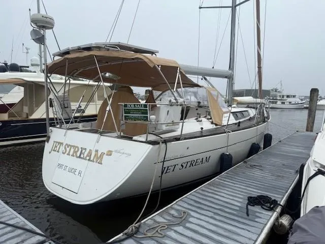 Slide: The Image of 2003 Wauquiez Centurion 45s sailboat named "Jet Stream" docked, for sale sign visible. - 6