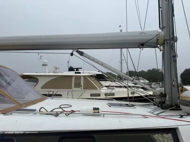 Slide: The Image of Sailboat Wauquiez Centurion 45s, 2003 model, docked in a marina with overcast sky. - 9