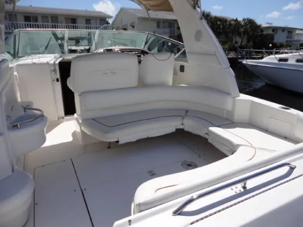 Slide: The Image of 2000 Sea Ray Sundancer 310 boat interior with white seating. - 11