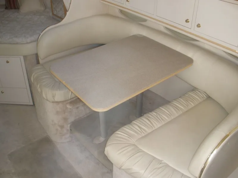 Slide: The Image of Interior of 2000 Sea Ray Sundancer 310 with dining area. - 21