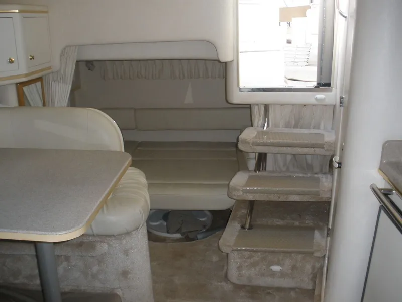 Slide: The Image of Interior of 2000 Sea Ray Sundancer 310 boat with seating and stairs. - 25