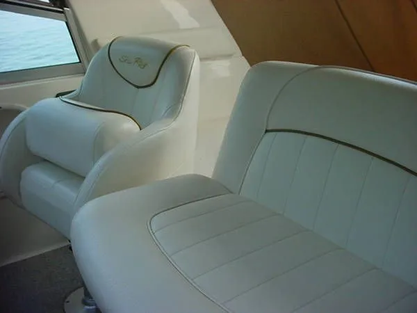 Slide: The Image of Interior of Sea Ray Sundancer 310, 2000, featuring white leather seats. - 4
