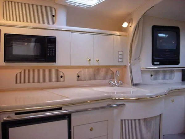 Slide: The Image of 2000 Sea Ray Sundancer 310 yacht interior kitchen area. - 7
