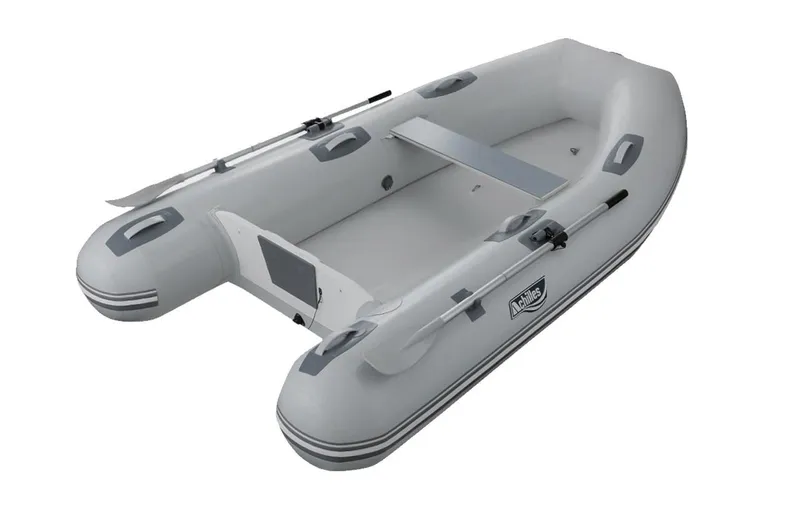 The Image of 2024 Achilles HB-270FX inflatable boat, white, with oars and seating. - 1
