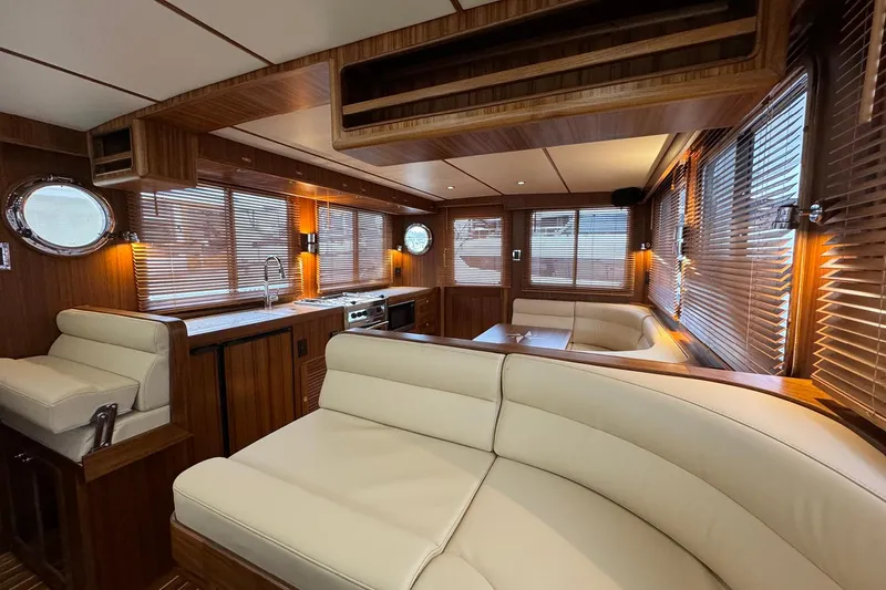 Slide: The Image of Luxurious interior of 2026 Helmsman Trawlers 38 Sedan with elegant wood and leather finishes. - 24