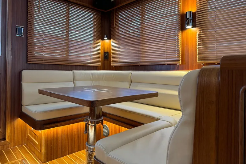 Slide: The Image of Luxurious interior of 2026 Helmsman Trawlers 38 Sedan with elegant seating and wooden accents. - 27