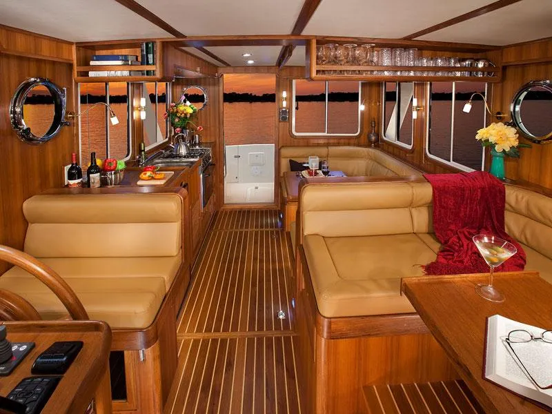 Slide: The Image of Luxurious interior of 2026 Helmsman Trawlers 38 Sedan with elegant wood finish. - 38