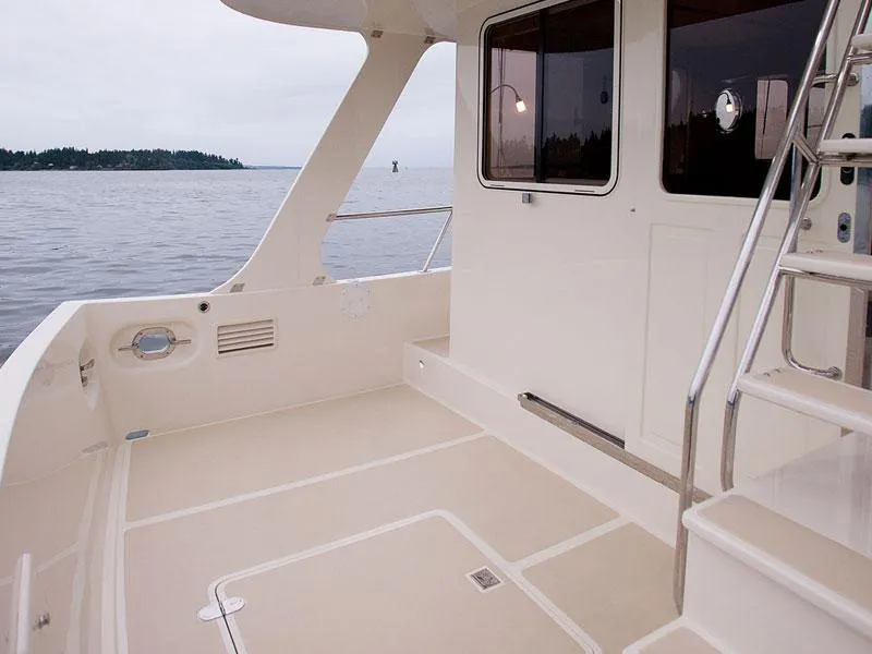 Slide: The Image of 2026 Helmsman Trawlers 38 Sedan boat deck with ocean view. - 40